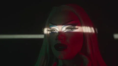 Portrait of Drag Queen with Light Beam on Eyes in Dark Stock Footage 252650019