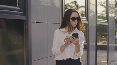 Portrait of Dressed in White Shirt Using Her Smartphone, Business Lady Stock Footage 136391979
