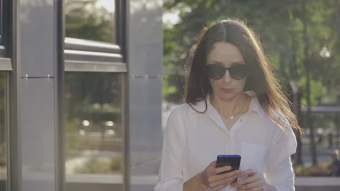 Portrait of Dressed in White Shirt Using Her Smartphone, Business Lady Video stock 136392164