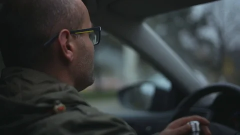 Portrait of driver man in car, drinks water from steel eco thermo bottle.	 Stock Footage 122732742