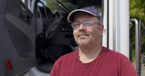 Portrait of driver standing by side of truck 4K Stock Footage 79866075