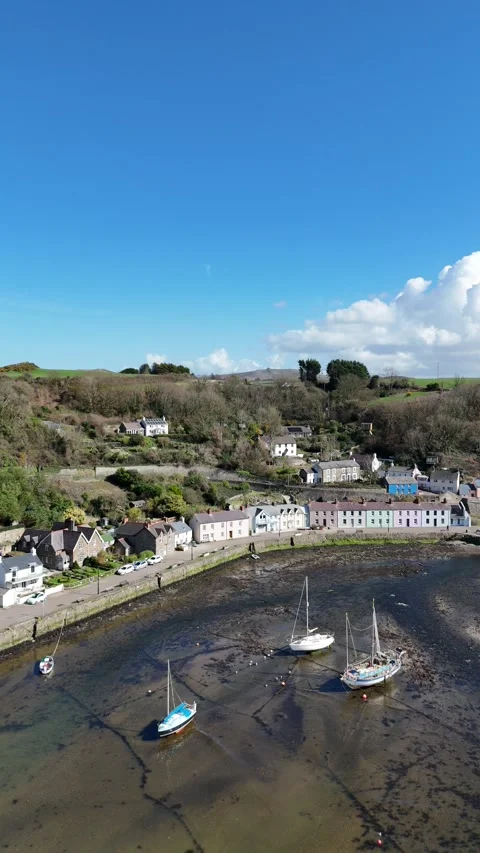 Portrait Drone of Lower Town Fishguard Quay with Boats, Wales UK Vidéo 332075361