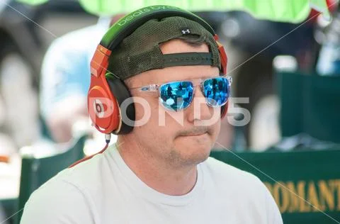 Portrait of drummer with sun glasses and headphones in outdoor Stock Photos