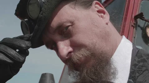 Portrait of an eccentric man with a beard and mustache wearing a hat with Stock Footage 170357140