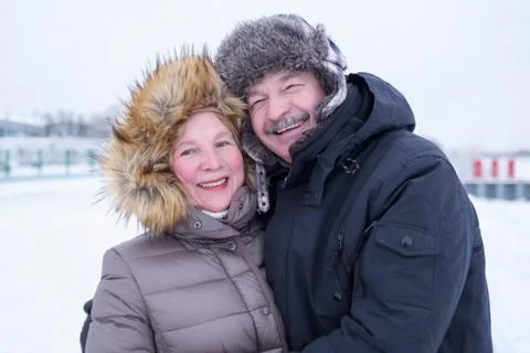 Portrait of elderly couple having fun outdoors in winter Stock Photos
