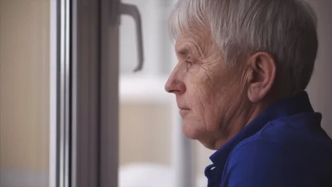 Portrait on elderly grey man face with blue eyes. He look near window 스톡 동영상 102044277