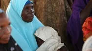 Portrait - Elderly Islamic African Woman Holds A Baby In Nigeria Stock Footage