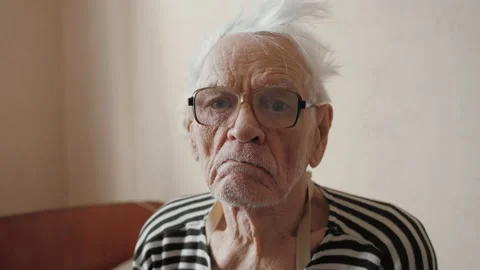 Portrait of elderly man 80-90 years old, wrinkled skin face looking at camera Stock Footage 149579535