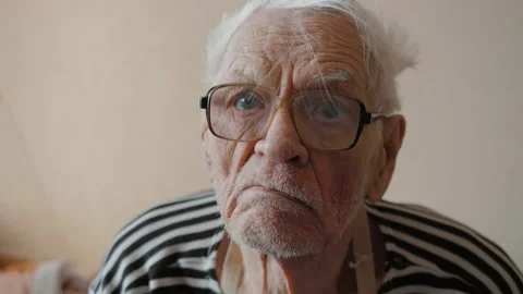 Portrait of elderly man 80-90 years old, wrinkled skin face looking at camera Video stock 149749732