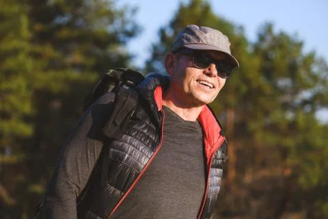 Portrait of an elderly man with a backpack Stock Photos