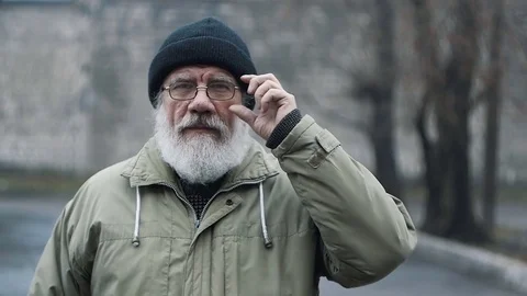 Portrait of an elderly man with a beard glasses Stock Footage 83430451