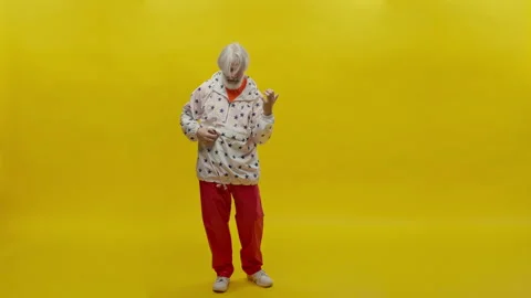 Portrait Of An Elderly Man With Beard. Gray Man On Yellow Background. Man Makes Stock Footage 168332867