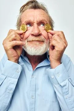Portrait elderly man cryptocurrency bitcoin face close up investment unaltered Stock Photos