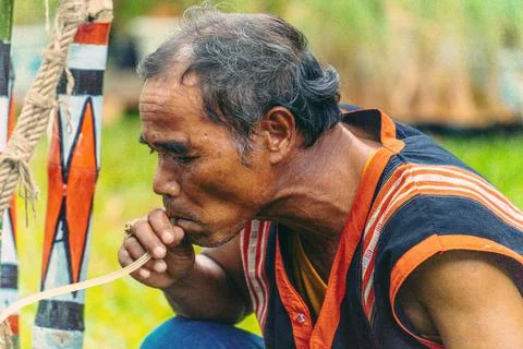 Portrait of elderly man drinking Ruou Can (vietnamese fermented rice wine in  Stock Photos