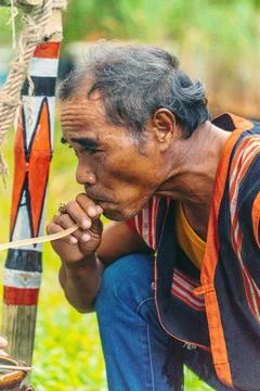 Portrait of elderly man drinking Ruou Can (vietnamese fermented rice wine in  Stock Photos
