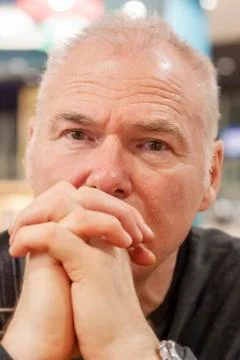 Portrait of an elderly man lost in thought Stock Photos