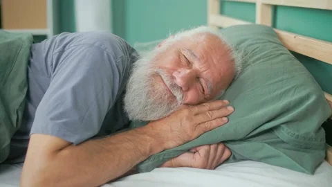 Portrait of an Elderly Man Sleeping Quietly on a Bed in His Room. Stock Footage 164415625