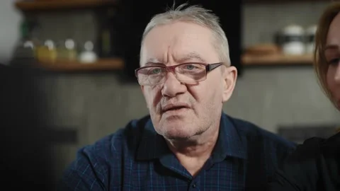 Portrait of an elderly man who is learning how to work with a laptop. The Stock Footage 234867507