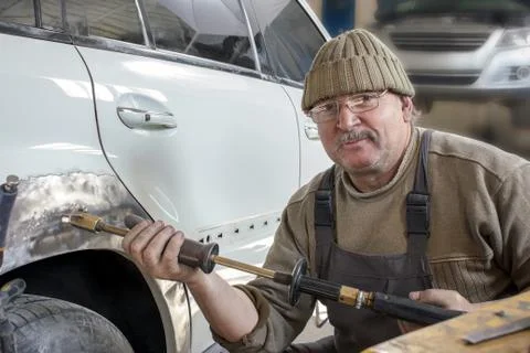 Portrait of an elderly mechanic Stock Photos
