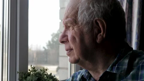 Portrait Elderly Old Man Looks Thoughtfully Out Of Window From House Stock Footage 190062176