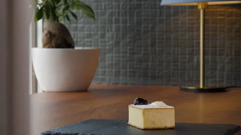 Portrait of an elegant square piece of cheesecake 스톡 동영상 168189236