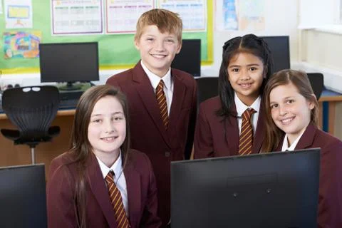 Portrait Of Elementary School Pupils In Computer Class Stock Photos
