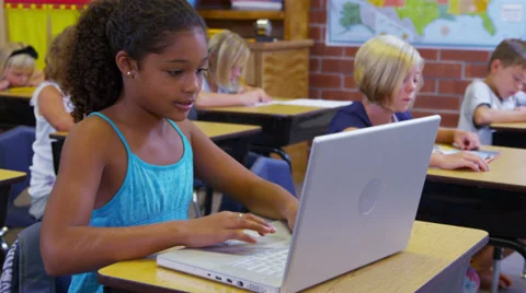 Portrait of elementary school student with laptop computer Stock Footage 32728469