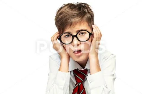 Portrait of emotional schoolboy in glasses. Childhood, education. Kid, studyi Stock Photos