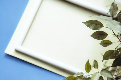 Portrait empty frame mockup on blue background Stock Photos