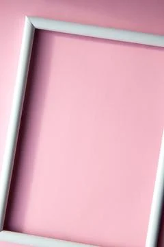 Portrait empty frame mockup on pink background Stock Photos