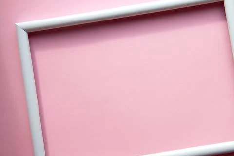 Portrait empty frame mockup on pink background Stock Photos
