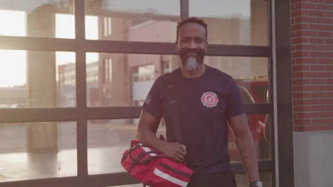Portrait of an EMT in Front of the Fire Station Video stock 208783718