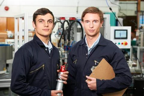 Portrait Of Engineer And Apprentice In Factory Foto stock