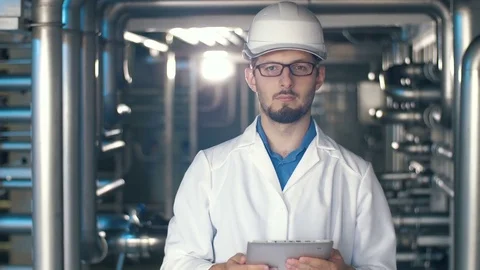 Portrait of engineer at the factory Stock Footage 77543872