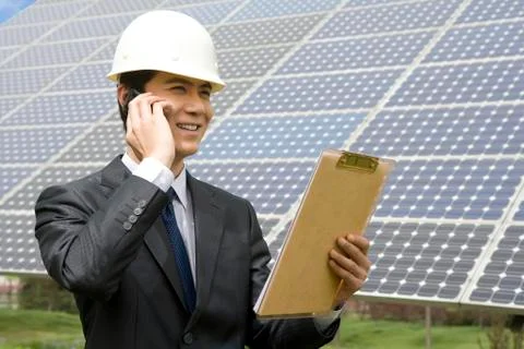 Portrait of an engineer in front of solar panels Stock-Fotos