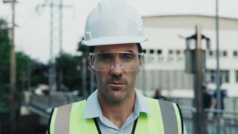 Portrait of engineer in gear nodding head in confirmation Stock Footage 311070456