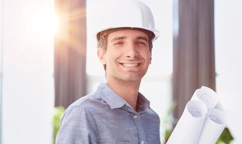 Portrait of an engineer in a hard hat posing for the camera Stock Photos