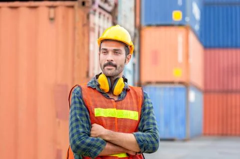 Portrait of Engineer man in hard hat and safety vest, worker with protective  Photos