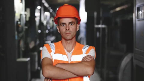Portrait of an engineer man or worker crossing arms, working in electrical room Stock Footage 194615754