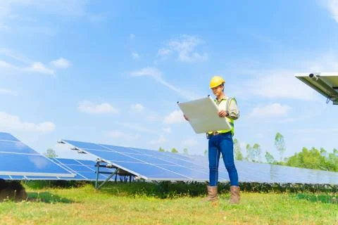 Portrait of engineer man or worker, people, with solar panels or solar cells  Foto stock