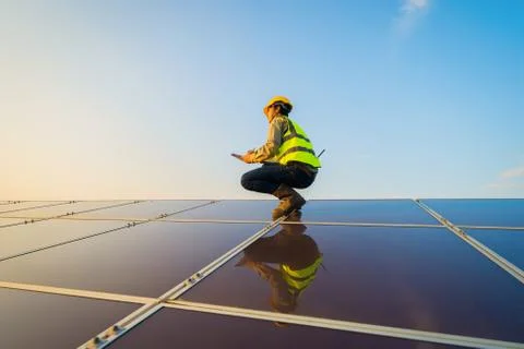 Portrait of engineer man or worker, people, with solar panels or solar cells  스톡 사진