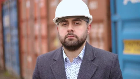 Portrait of an engineer in a port. Outdoor logistics for import and export or Stock Footage 306217341