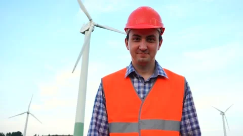Portrait of Engineer Saying Yes by Head Shake. Wind farm and worker man Stock Footage 137428258