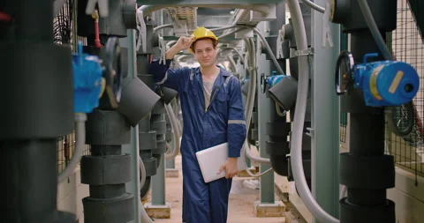 Portrait engineer smiling looking to camera and checking industry cooling air co Stock Footage 249958907