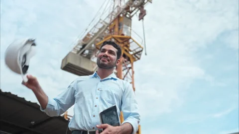 Portrait of engineer with tower crane for lift and move objects Video stock 291852630
