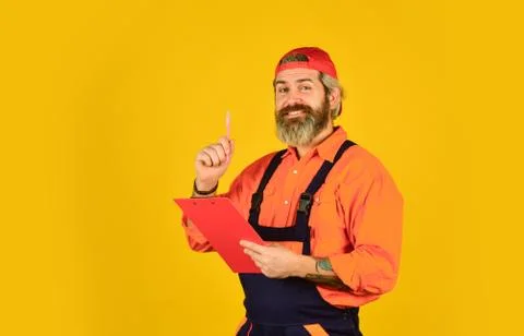 Portrait of engineering man. construction worker holding folder. Structural plan Stock Photos