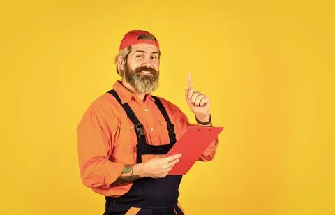 Portrait of engineering man. construction worker holding folder. Structural plan Stock Photos