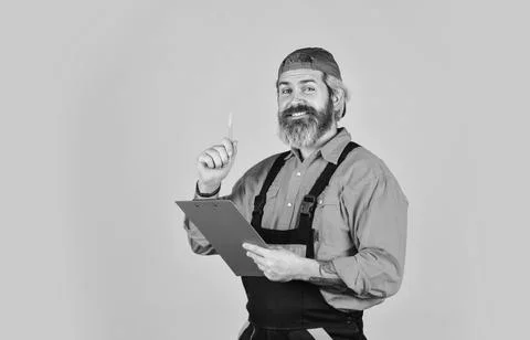 Portrait of engineering man. construction worker holding folder. Structural plan Stock Photos
