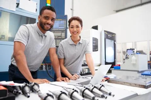 Portrait Of Engineers Using CAD Programming Software On Laptop Stock Photos