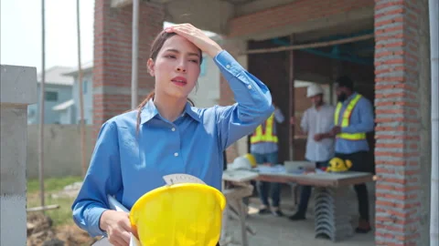 Portrait of engineers work together to assess the residential home Stock Footage 308922878